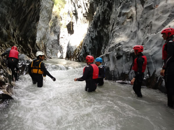 Body rafting experience inside the Alcantara basalt canyon in Sicily
