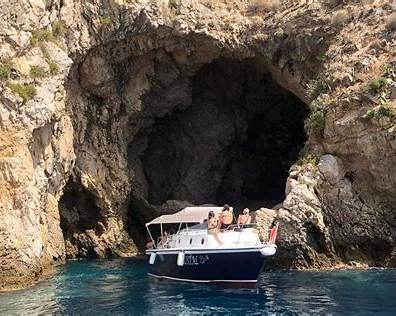 Giardini Naxos boat tour along the Taormina coastline with bays and cliffs