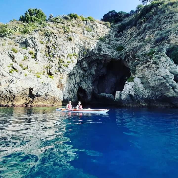 Guided kayak tour from Giardini Naxos exploring coastal caves and cliffs