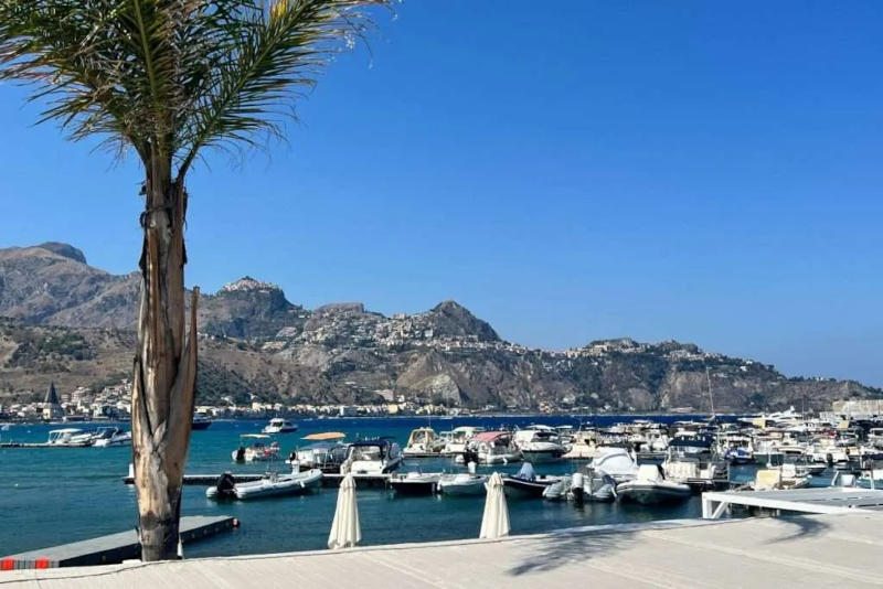Main port of Giardini Naxos with boat tour departures and meeting points