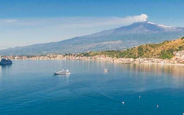 Giardini Naxos bay, mount etna on the background