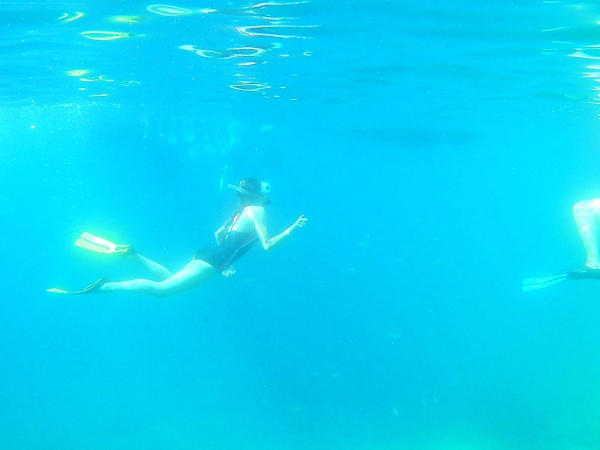 Snorkeling tour in the Taormina Marine Park with clear water and rocky seabed